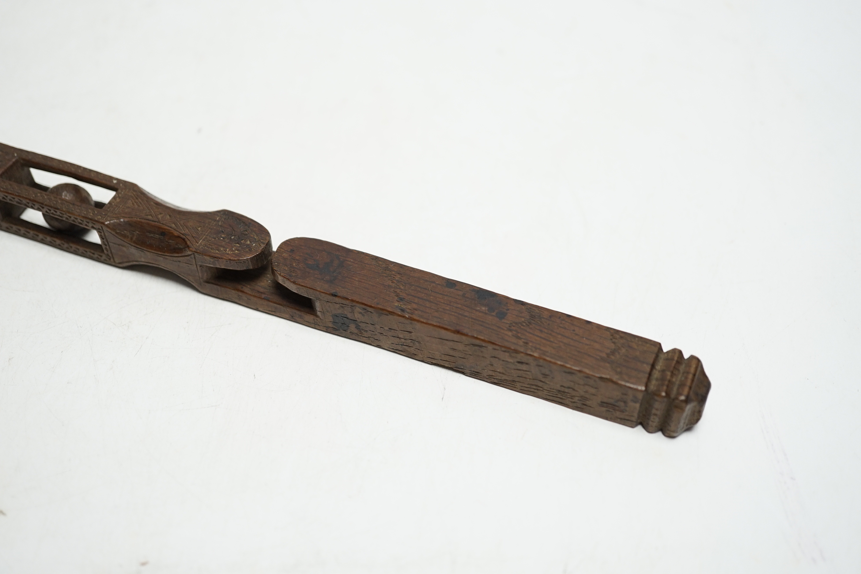 An 18th century carved wood love token, probably Welsh, 21.5cm